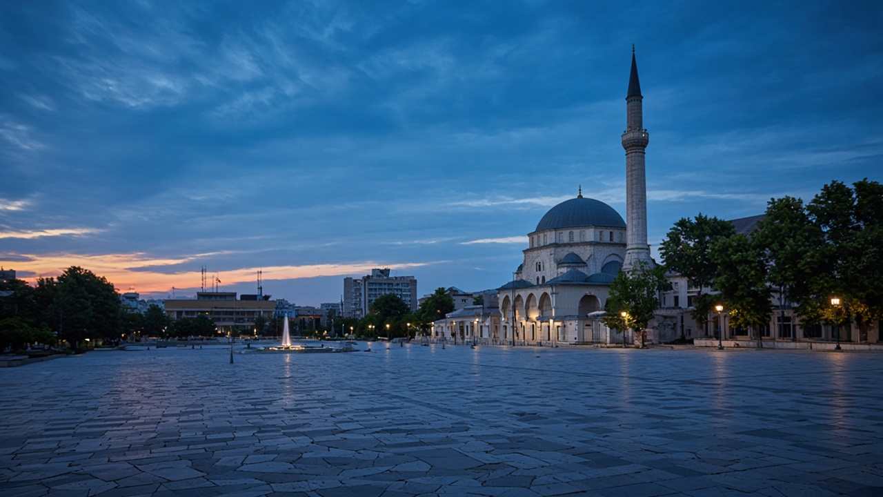 Skanderbeg Square and the Et'hem Bey Mosque in Tirana at dusk, no readable text