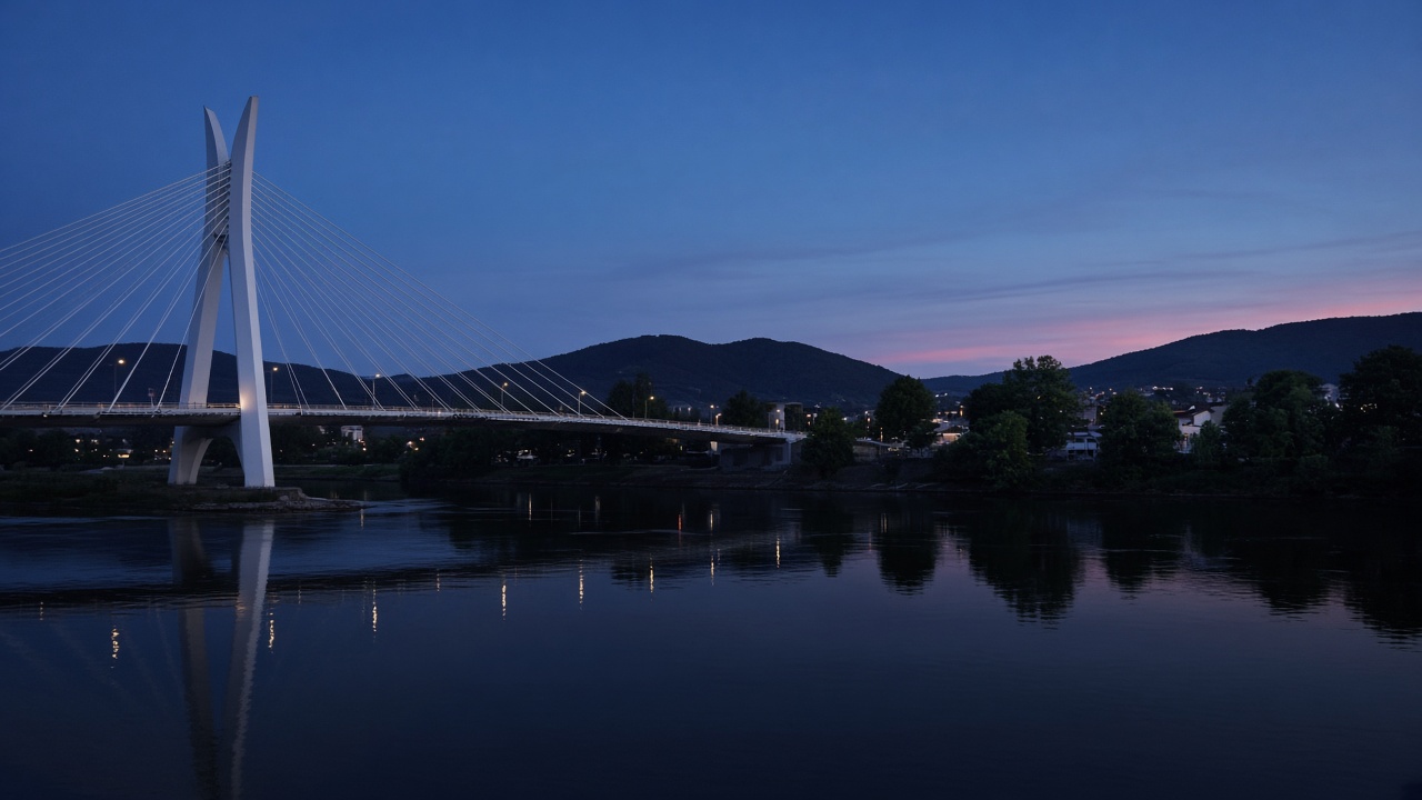The Millennium Bridge and the Morača in Podgorica at dusk, no readable text