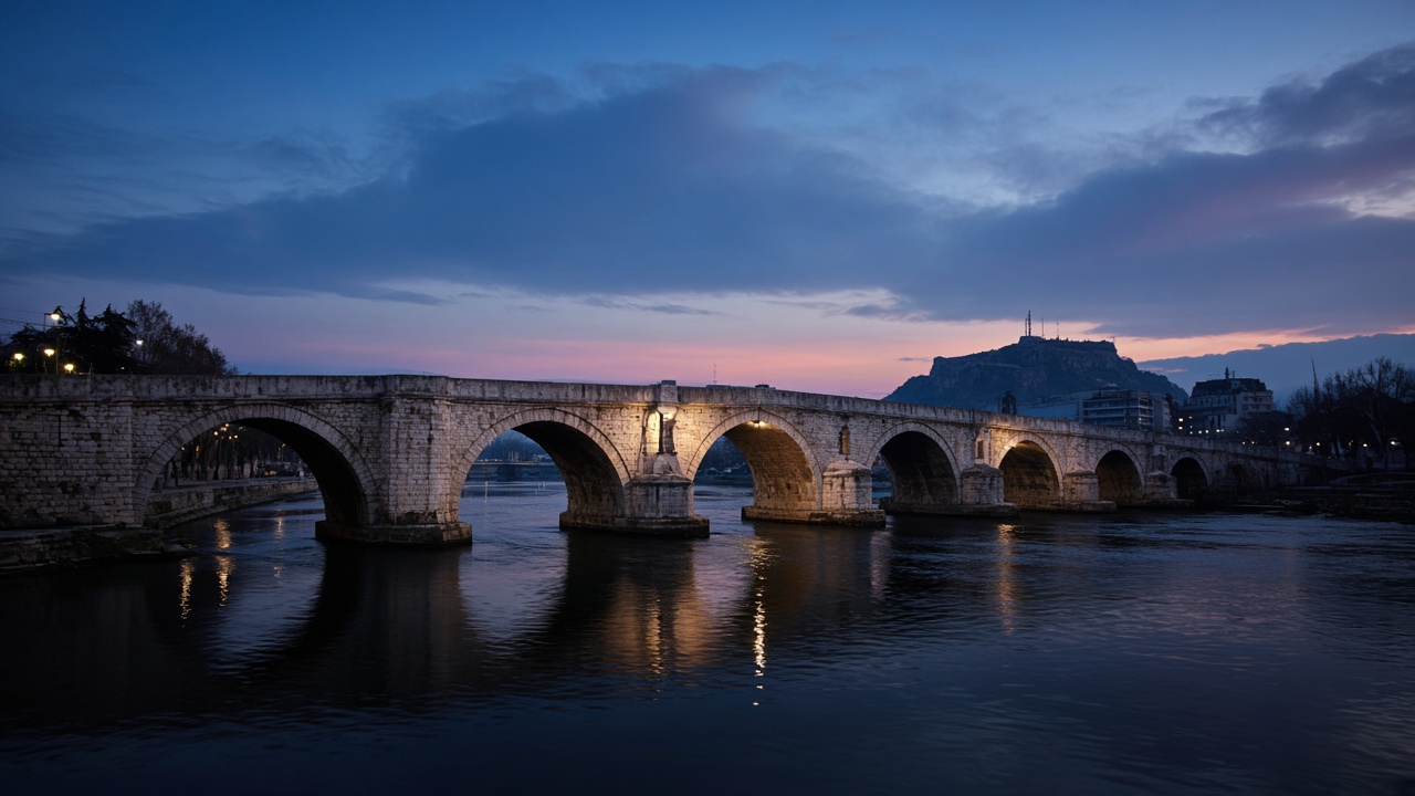 The Stone Bridge and the Vardar in Skopje at dusk, no readable text